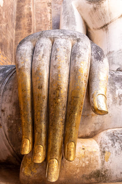 istock Wat Si Chum buddha hand at Sukhothai 1384549143