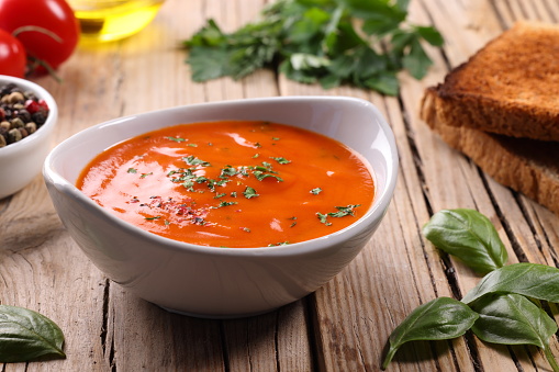 Tomato Soup with a sprinkling of Parsley and Basil