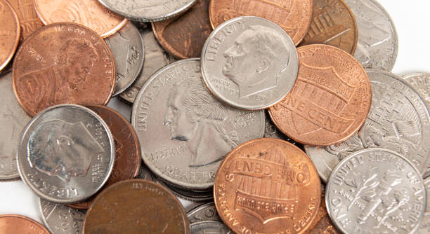 istock Scattered American coins on a white background 1384556357