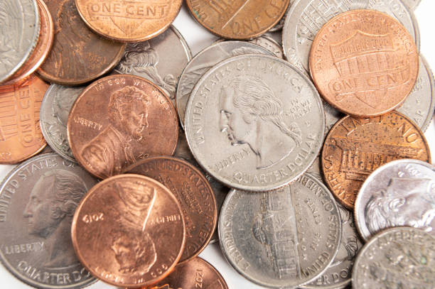 istock Scattered American coins on a white background 1384556368