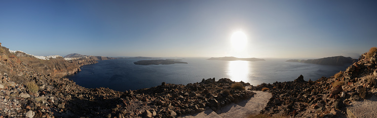 the bay of Santorini with the city of fira on the left, the island of Nea Kameni in the center and the island of Thirasia on the right