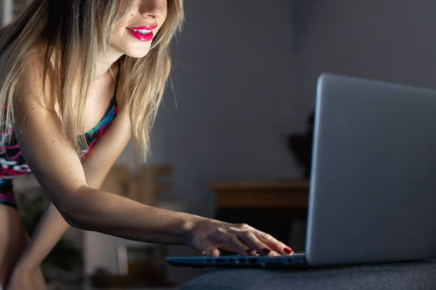 istock Woman with her computer in an online session at home 1384570591