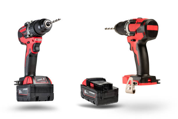 istock cordless tool isolated on white background. Cordless screwdriver with a drill inserted into the chuck and an extra battery on a white background 1384573214
