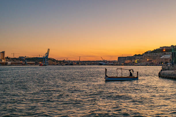 A view of Malta and the typical boat at the sunset