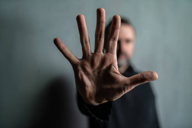 istock Depressed mature man, alone in darkness, stop the war concept. 1384582088