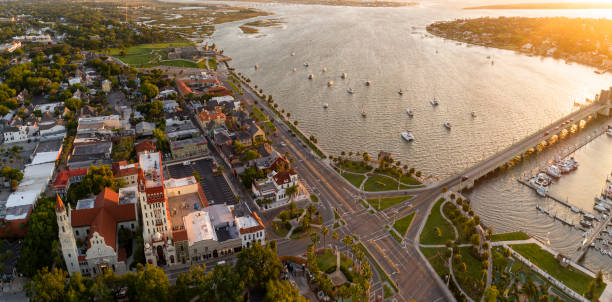 aerial view of the downtown saint augustine with the cathedral basilica of st. augustine, and the bridge of lions over the matanzas river, florida, in the early morning.  extra-large, high-resolution stitched panorama. - saint augustine cathedral imagens e fotografias de stock