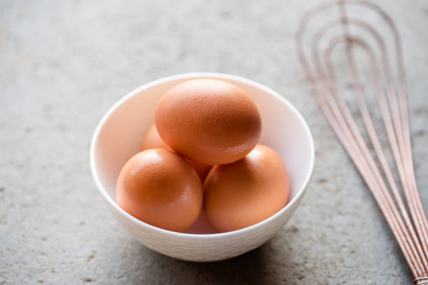 istock Whole Brown Chicken Eggs in a Bowl 1384583483