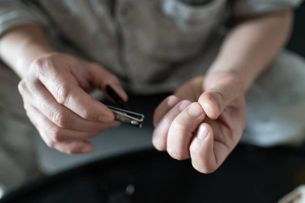 istock The man’s hand was cutting his nails. 1384583777