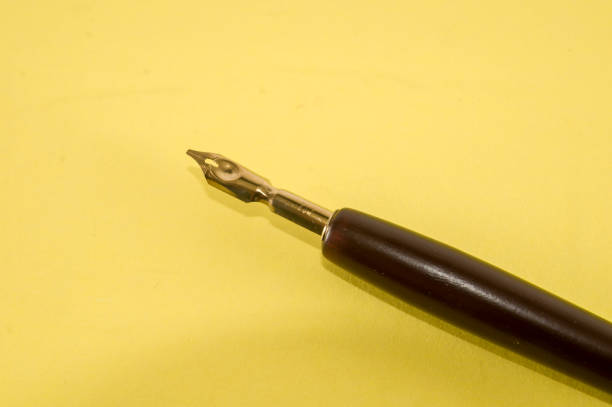 istock Antique ink pen background 1384585424