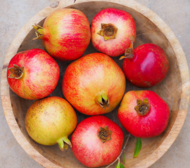 istock Fresh ripe pomegranates prepared for juice 1384587475