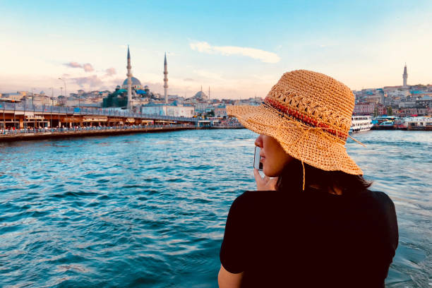 female model taking photos in istanbul, turkey - galata kulesi fotoğraflar stok fotoğraflar ve resimler