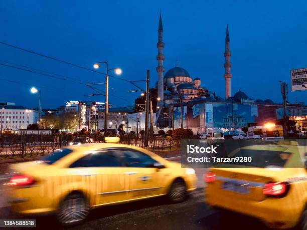 Yellow Cabs On Galata Bridge And The Yeni Mosque Istanbul Turkey Stock Photo - Download Image Now