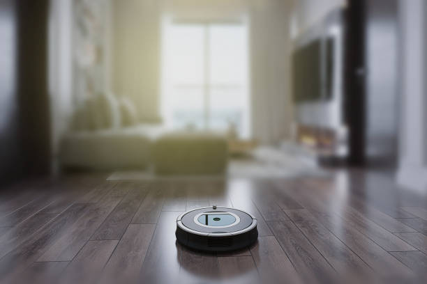 istock Robots vacuums cleaners on wood floor 1384591753