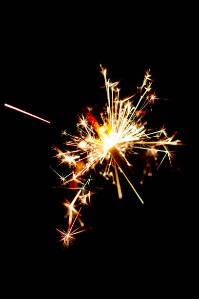 istock One bengal fire sparkles against the black background. 1384592608