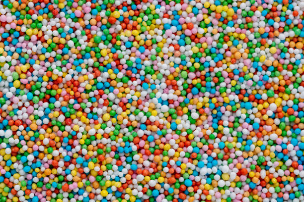 istock Thousands sprinkles tiny sugar beads for decorating cakes and desserts background. 1384592664
