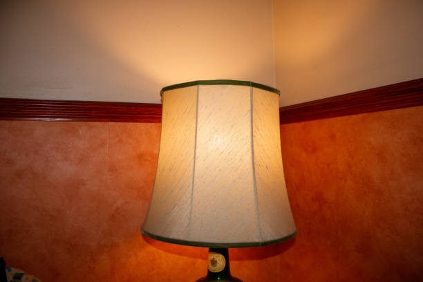 istock Table lamp in corner of room 1384592831