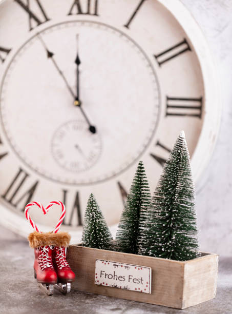 istock Christmas clock with winter decoration. Happy new year concept 1384593627