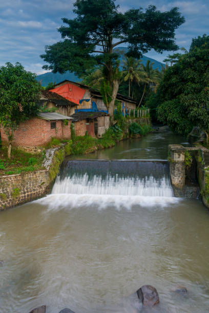 istock river between trees and people's houses 1384594677
