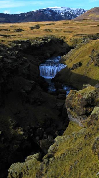 istock Waterfall and mountain view in Iceland 1384596509