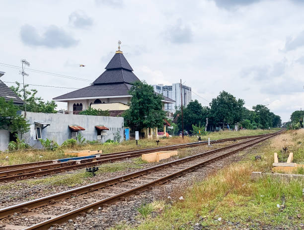 istock railroad tracks with several rails next to people's houses 1384596847