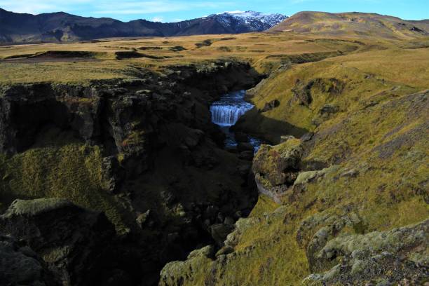 istock Waterfall and mountain view in Iceland 1384600506
