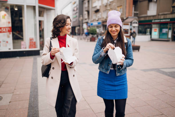 istock Girlfriends walk around the city 1384603874