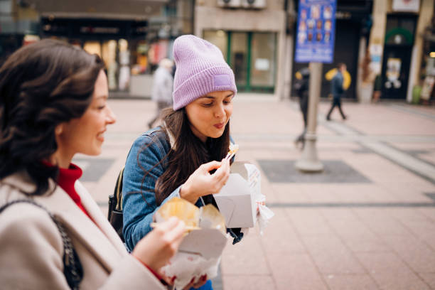 istock Two beautiful women walking on the street 1384603901