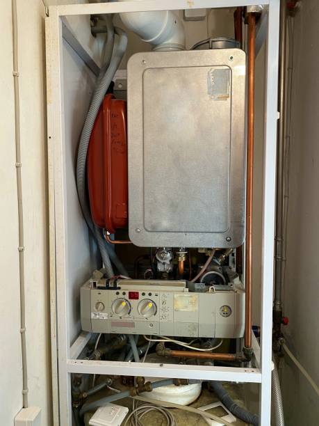 istock Inside of a 20 year-old gas boiler. 1384604346