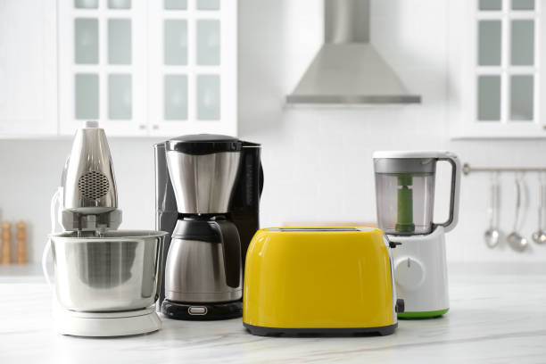 istock Modern toaster and other home appliances on white marble table in kitchen 1384608172