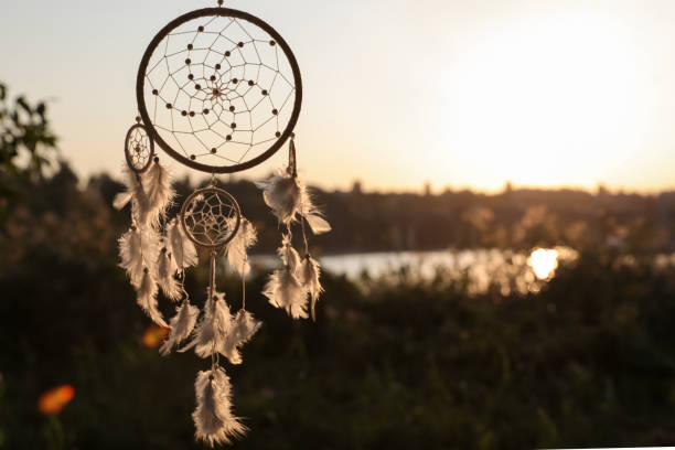istock Beautiful handmade dream catcher outdoors. Space for text 1384610432