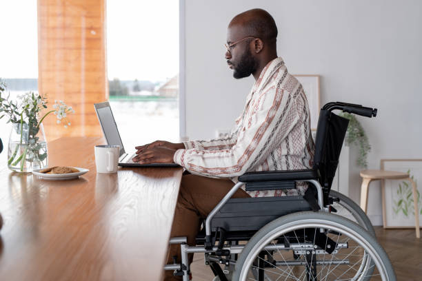 istock Side view of serious black man working in the net or analyzing online data 1384610461