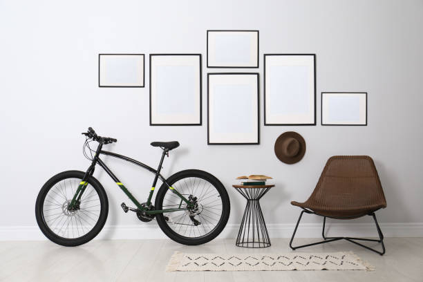 istock Stylish room interior with empty posters on light wall. Mockup for design 1384611192