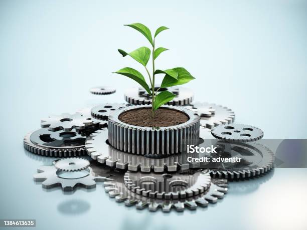 Plant Growing Inside The Flower Pot Shaped Cogwheel In Motion Sustainable Industrial Growth Concept Stock Photo - Download Image Now