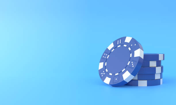 istock Blue poker chips on a blue background with copy space 1384613818