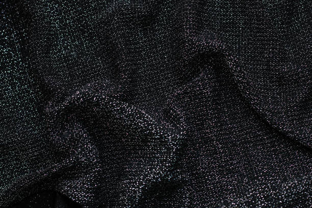 istock Texture of shiny lurex fabric silver and black color 1384613831