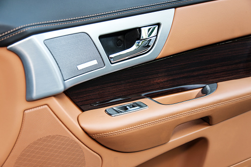 The interior of a luxury car door.