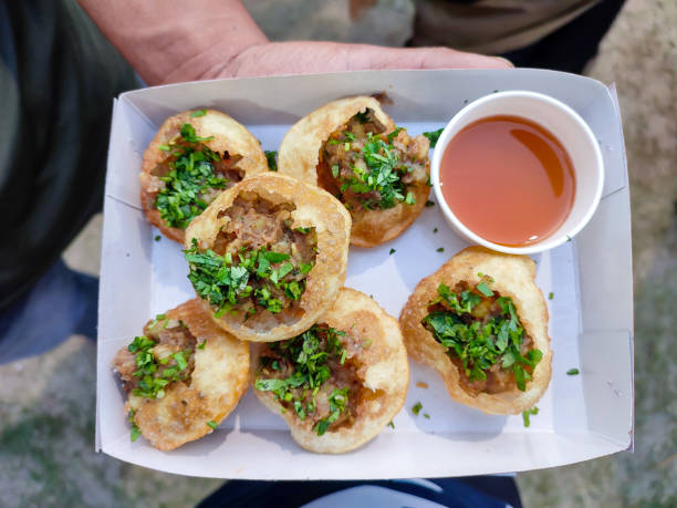 Golgappa panipuri Khatta mittha fuchka a spicy Indian snacks ready to be eaten Golgappa panipuri Khatta mittha fuchka a spicy Indian snacks ready to be eaten In kolkata food festival food festival stock pictures, royalty-free photos & images