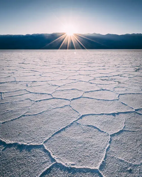 California Death Valley Badwater Basin Sun star at sunset salt flats