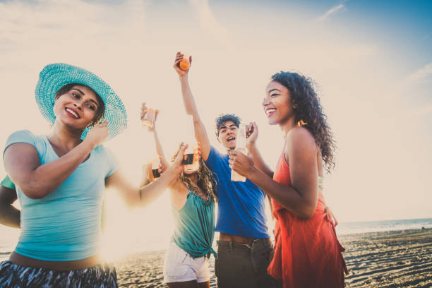 istock Friends partying on the beach 1384625521