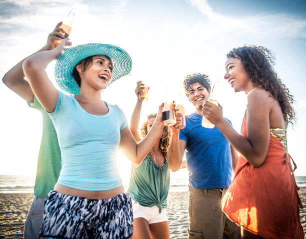 istock Friends partying on the beach 1384625535