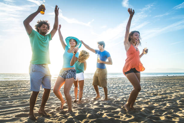 istock Friends partying on the beach 1384625911