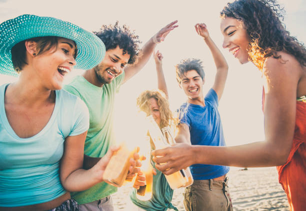 istock Friends partying on the beach 1384626015