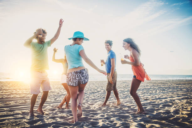 istock Friends partying on the beach 1384626123