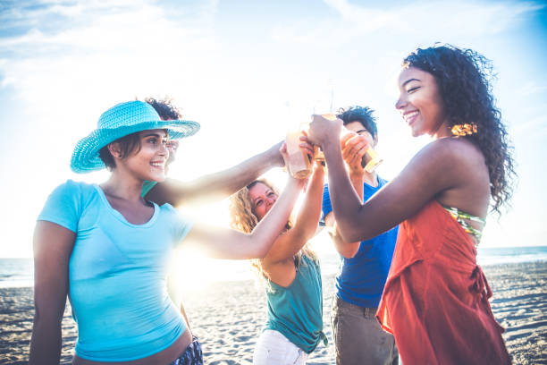 istock Friends partying on the beach 1384626157