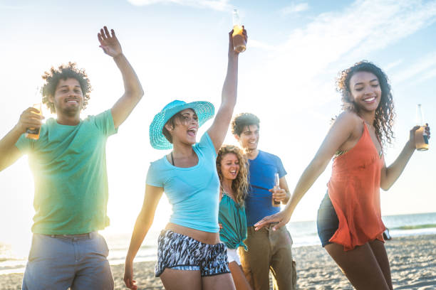 istock Friends partying on the beach 1384627024