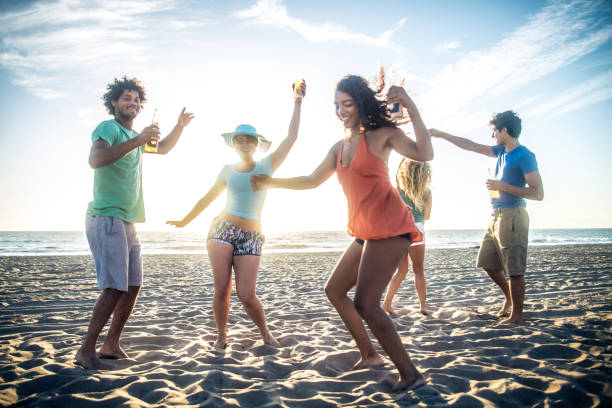 istock Friends partying on the beach 1384627238