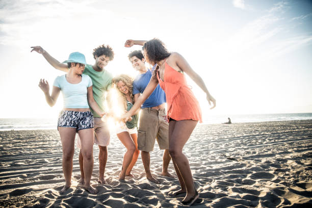 istock Friends partying on the beach 1384627272