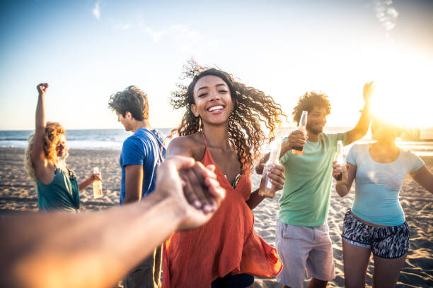 istock Friends partying on the beach 1384627403