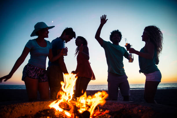 istock Friends partying on the beach 1384629259