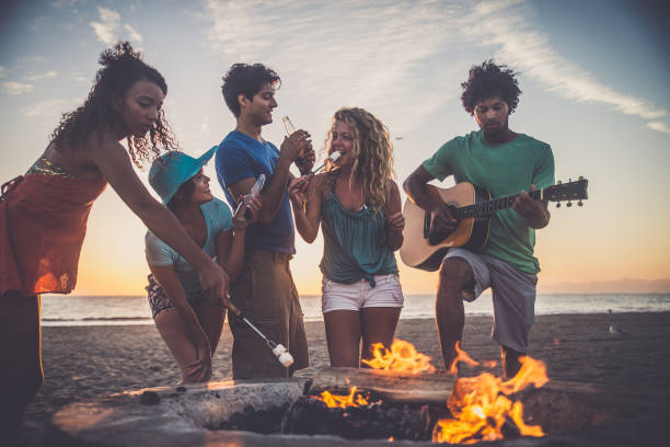 istock Friends partying on the beach 1384629452